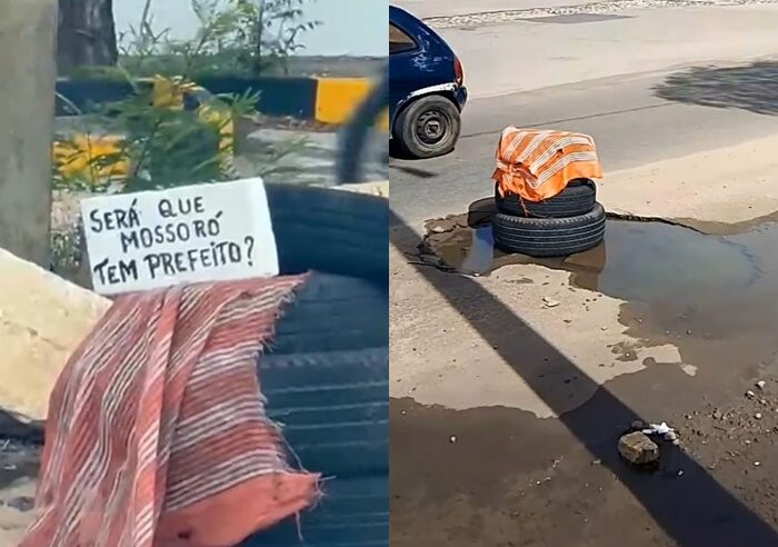 Moradores sinalizam buraco com pneus e cartaz em Mossoró